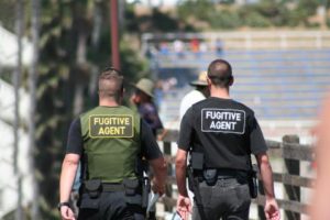 Picture of two Texan bail bondsman walking down the street in Lubbock